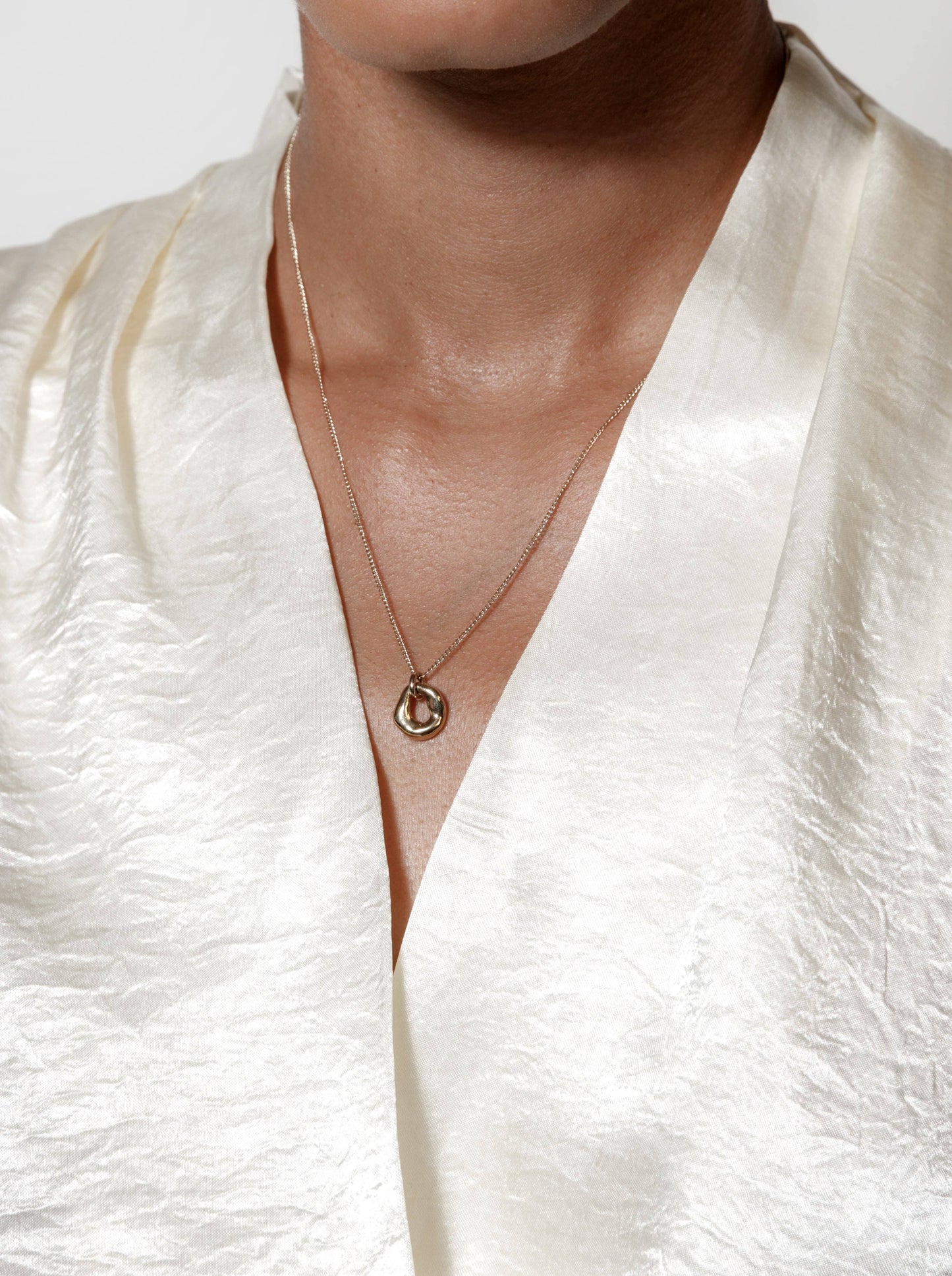 Gold Textured Oval Pendant Necklace