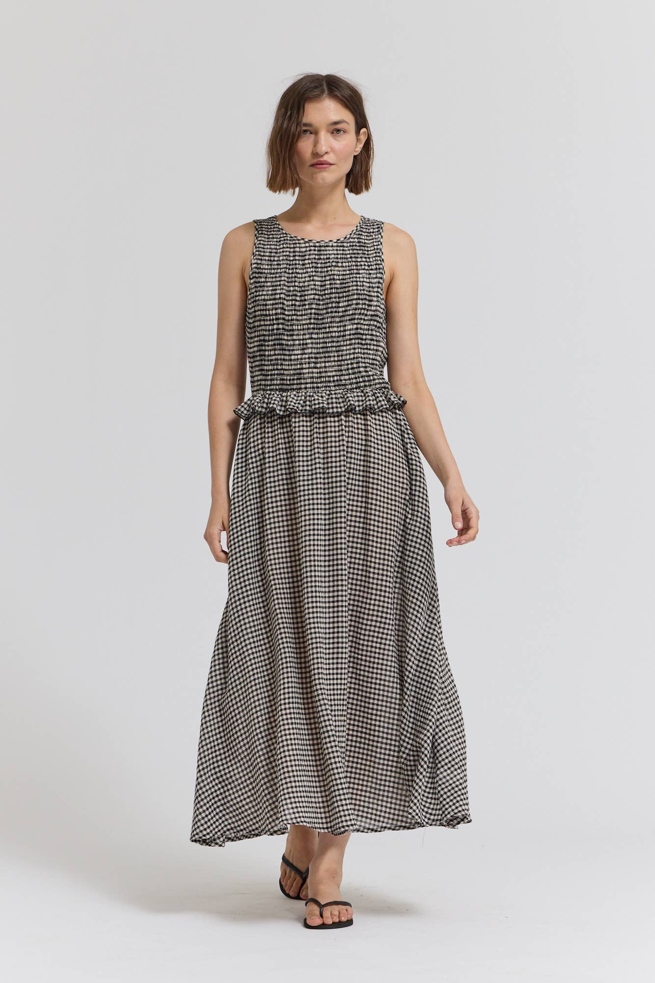 Black Check Sleeveless Peplum Smocked Dress