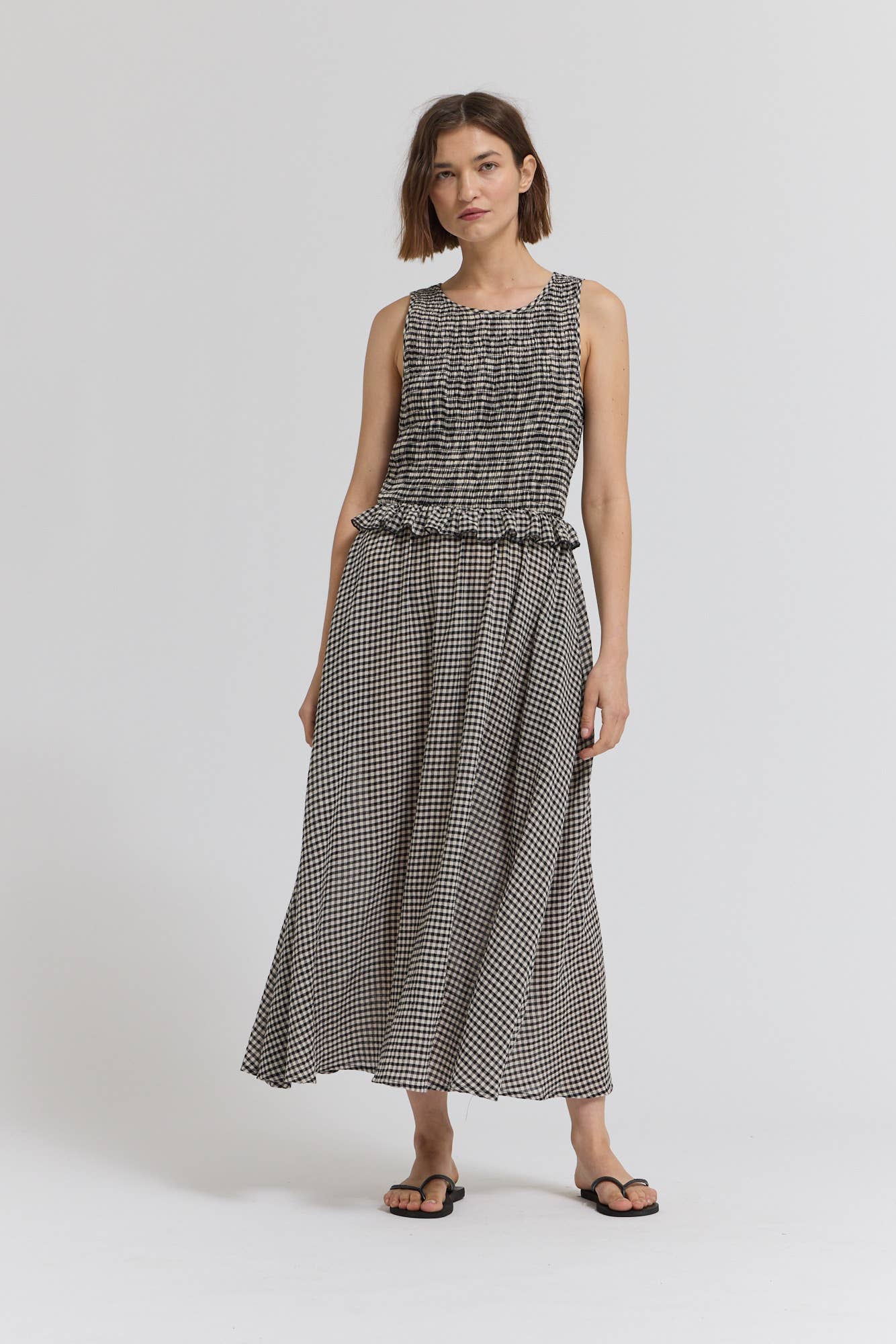 Black Check Sleeveless Peplum Smocked Dress