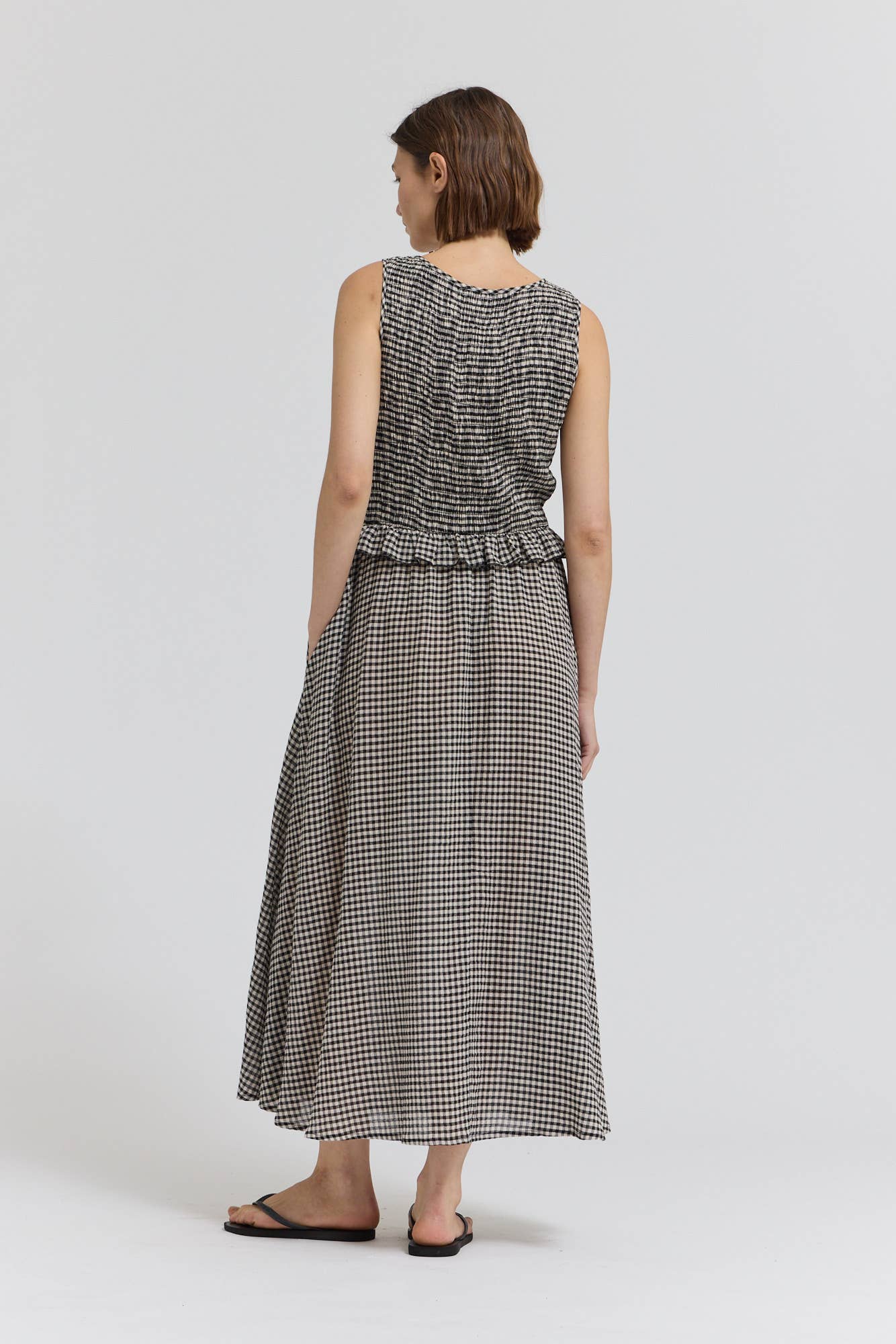 Black Check Sleeveless Peplum Smocked Dress