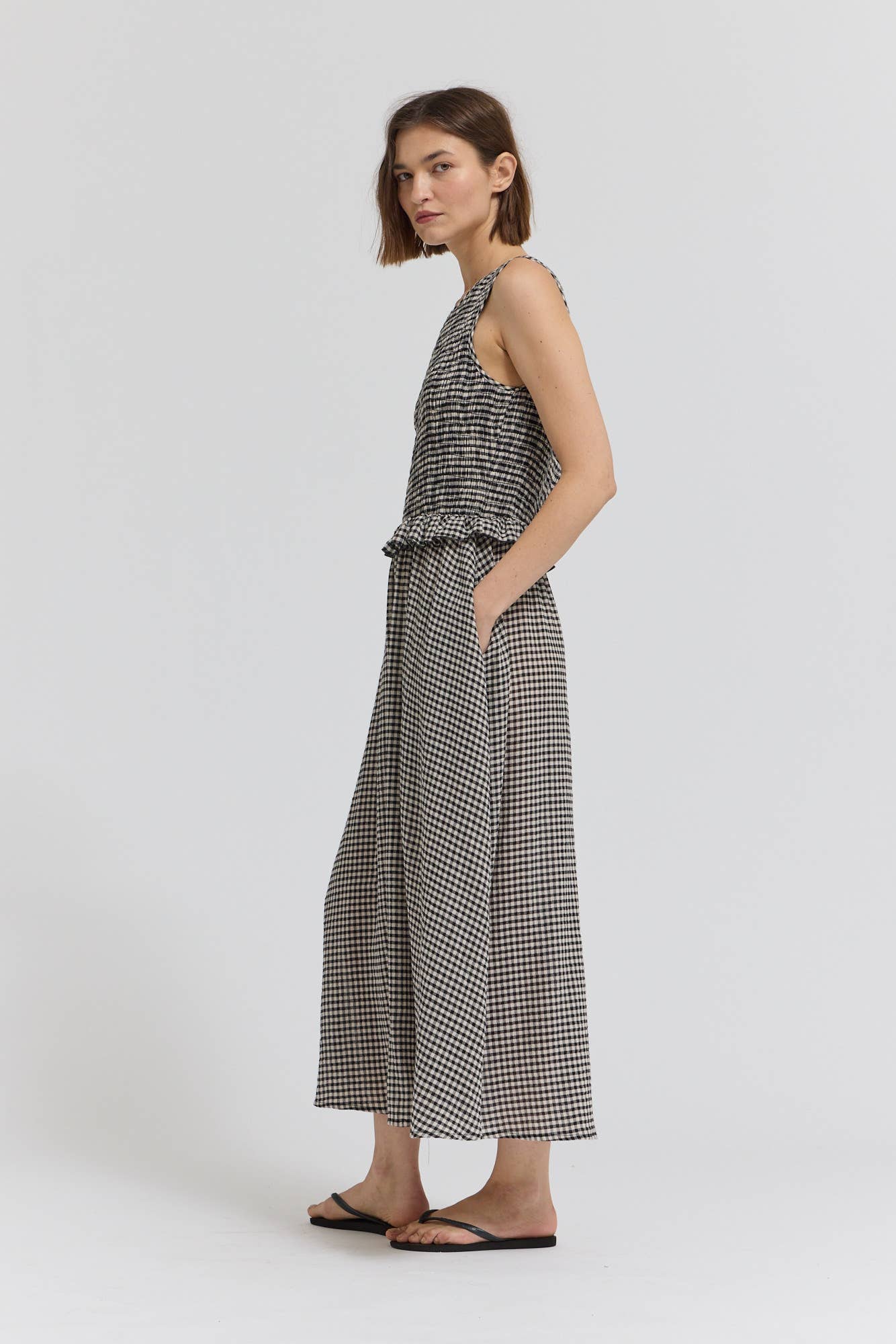 Black Check Sleeveless Peplum Smocked Dress